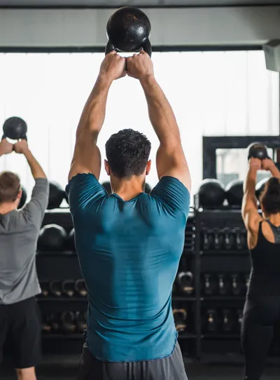 Group kettlebell workout in a gym